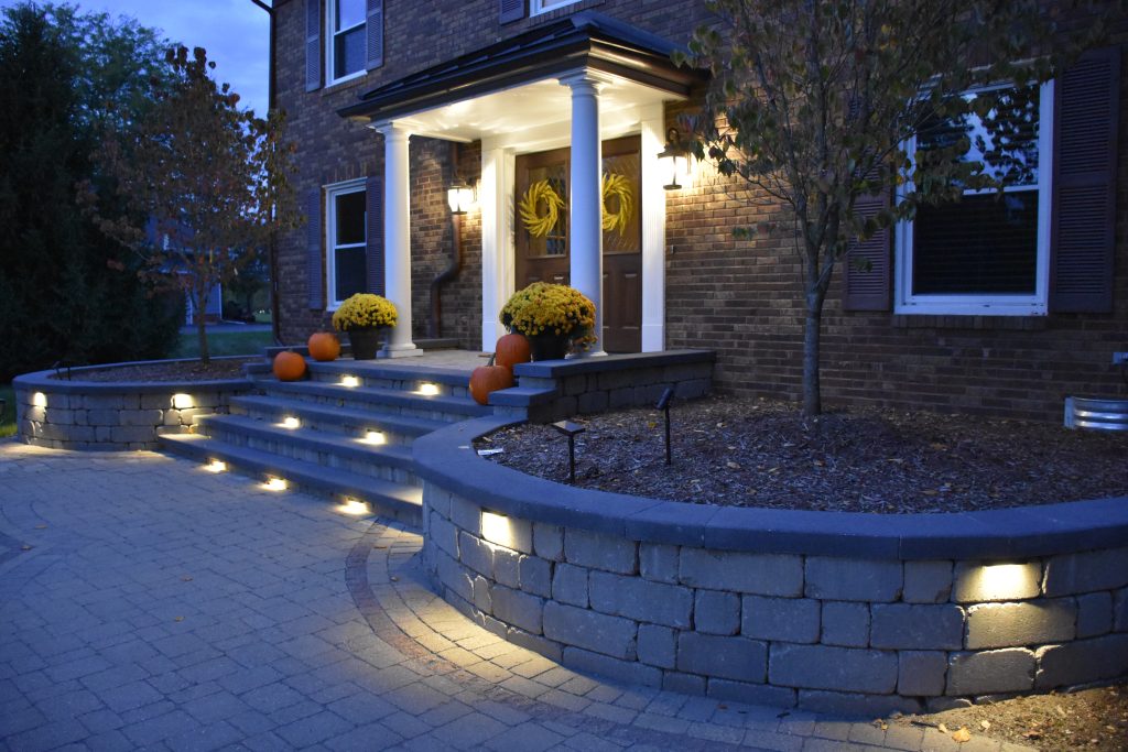 Walkway lit up a night towards the front porch area of an Ann Arbor home