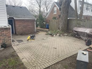 Before picture of a worn out patio that needs replaced.