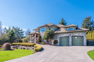 Luxury home with beautifully landscaped front yard. 